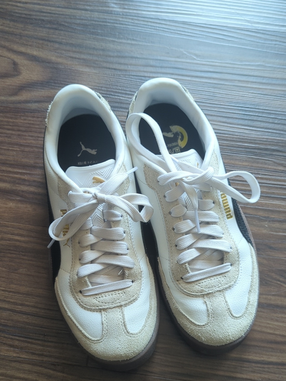 Puma White Sneakers with Black & Gold Accents